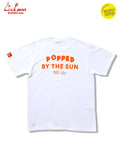 White t-shirt with orange text 'Popped by the Sun' on a white background