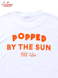 White t-shirt with 'Popped by the Sun' text in orange on a white background