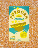 Box of Popqorn kernel on a popcorn kernel background