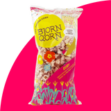 Bjorn Qorn Ruby Popcorn 3-Ounce bag on pink background. 