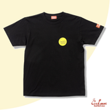 Black t-shirt with a yellow logo on a beige background