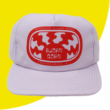 Licac colored cap with red and white logo on a yellow background