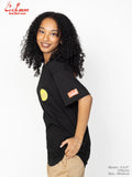 Woman wearing a black t-shirt with logos on a white background